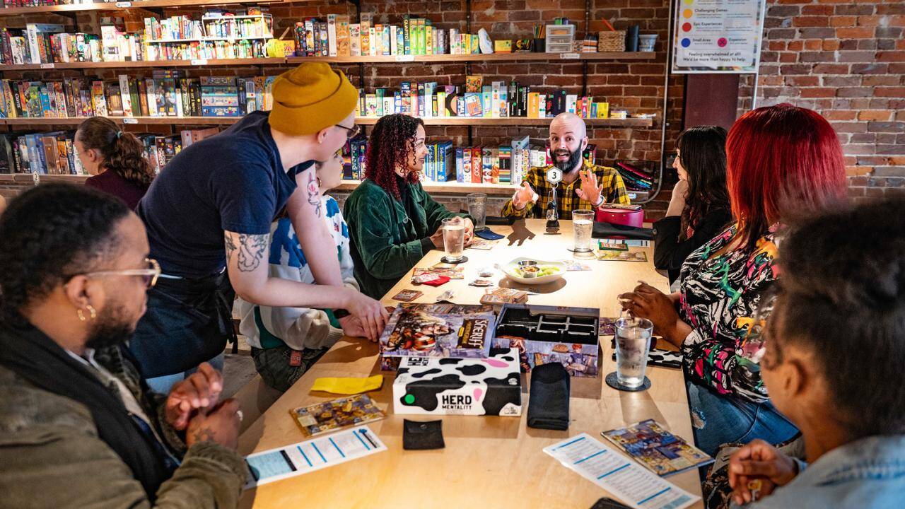 About | Caverns & Forests Board Game Café